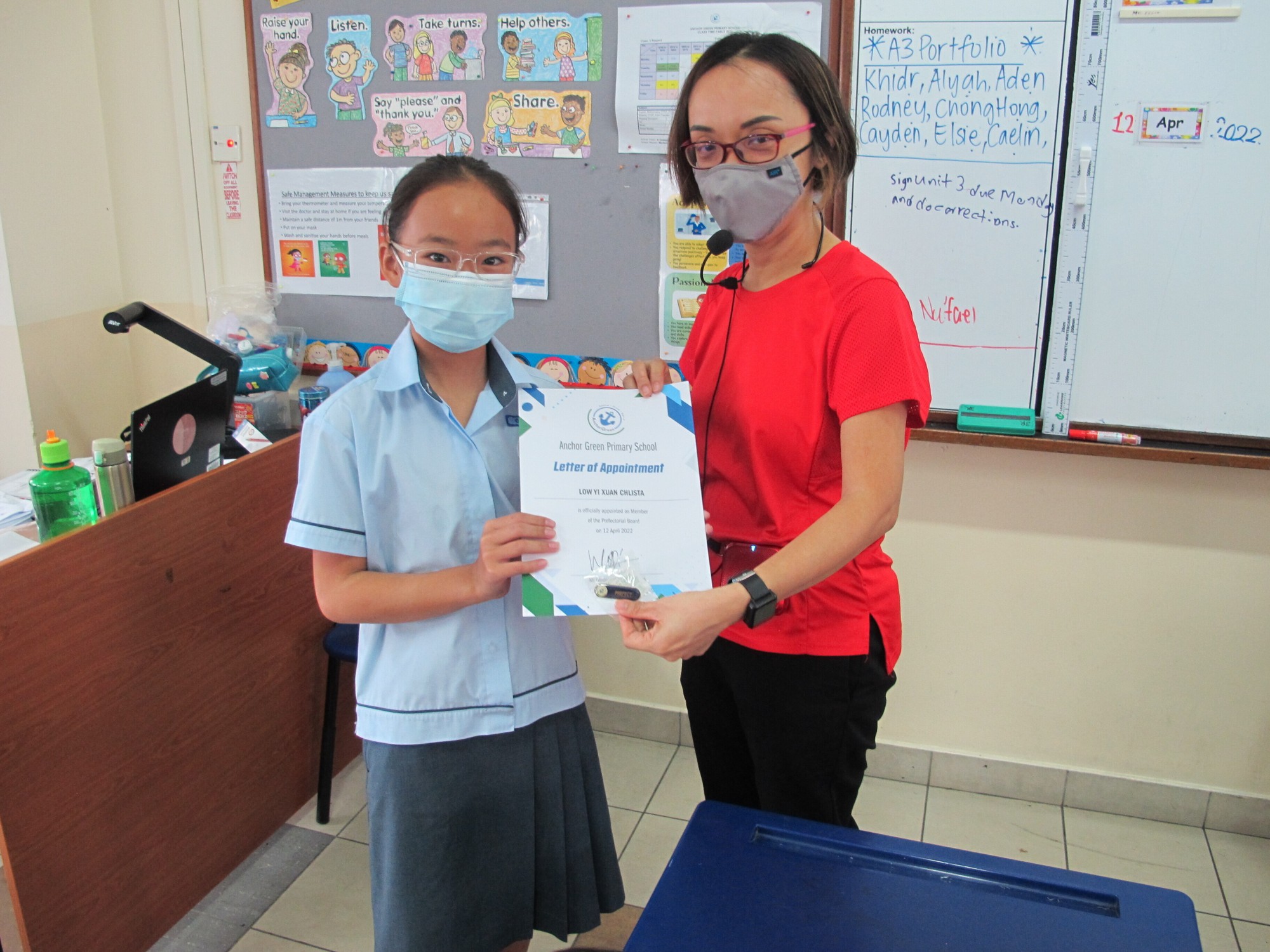 Our Prefect receiving the certificate of re-appointment from Form Teacher